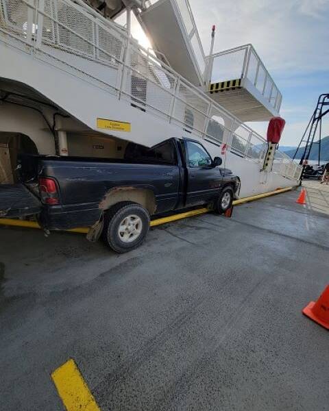 black pick up truck wedged into a BC Ferries galley ramp