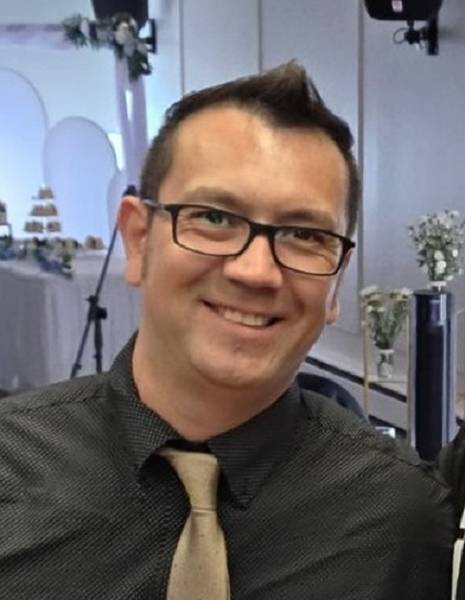 A head and shoulders photo of Thomas Kelly.